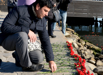 Baku residents bringing flowers to Seaside Boulevard to honor missing oil workers.  Azerbaijan, Dec.07, 2015